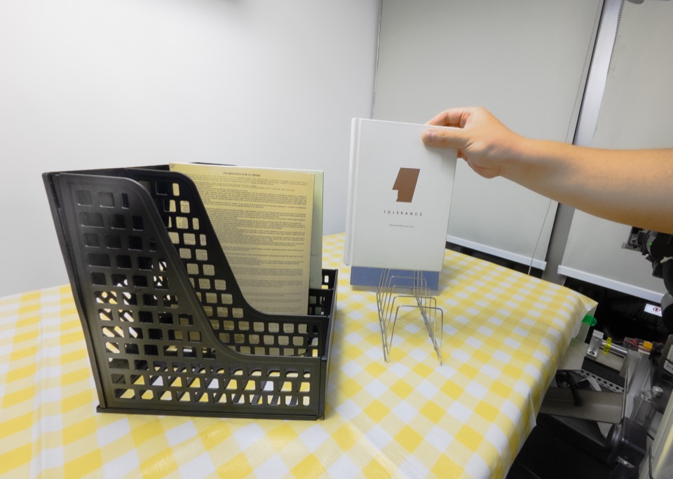 Insert a book onto a shelf, human demonstration frame 3